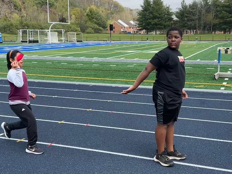 child with another child at the track