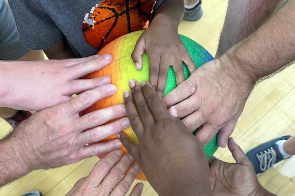 Hands around a ball