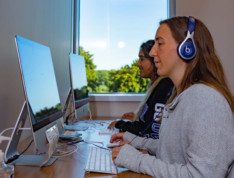 students wearing headphones in audiology services