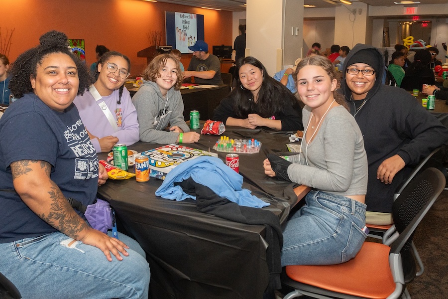 Students playing around a table