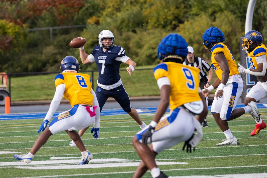 Southern quarterback throws the football as opposing players close in