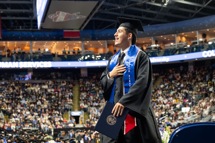A student at commencement on stage