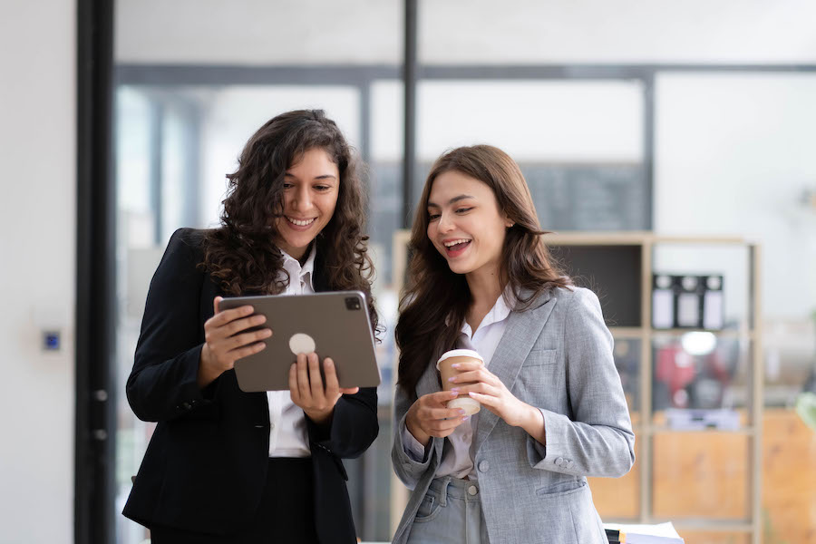 Two women looking at a tablet